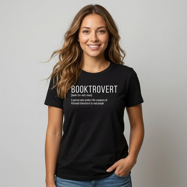 Woman wearing a black t-shirt with a dictionary-style definition of Booktrovert: a person who prefers the company of fictional characters to real people