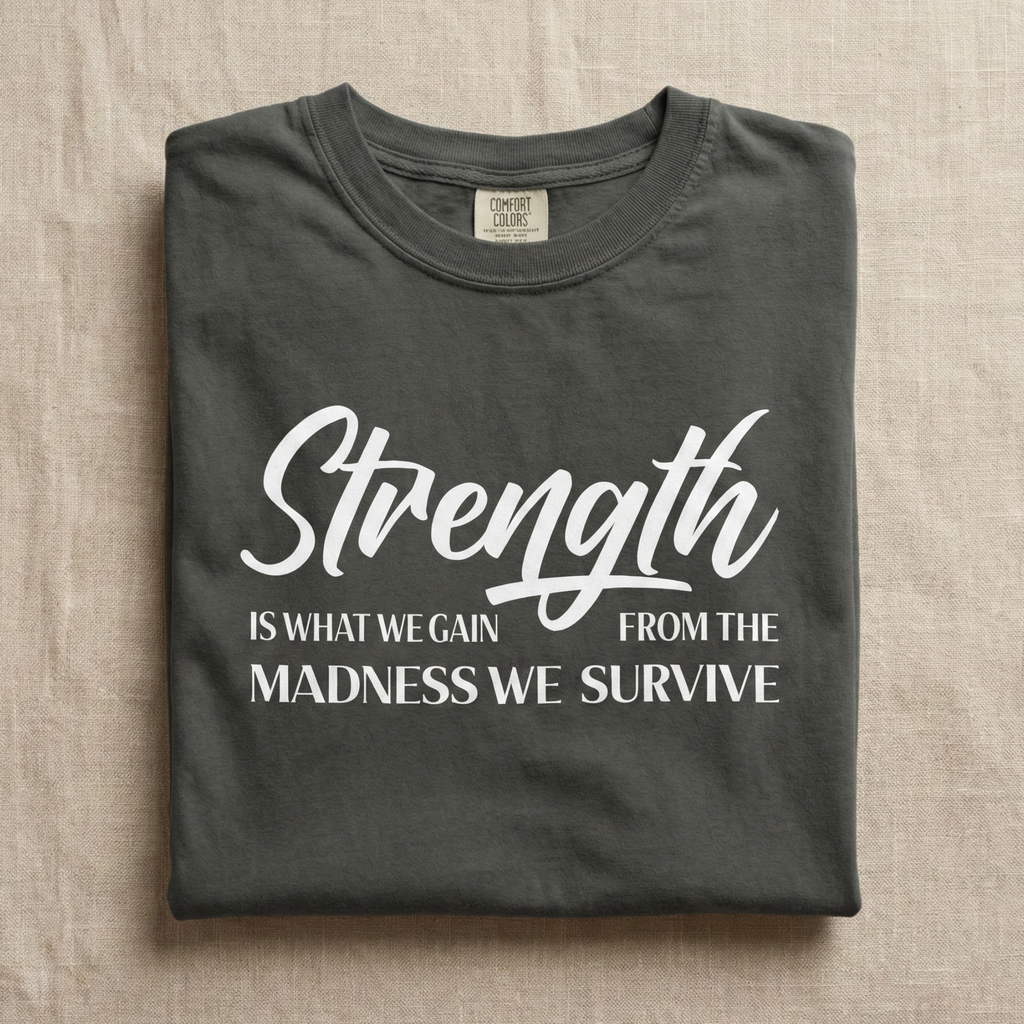 Strength Is What We Gain Encouragement Statement Tee