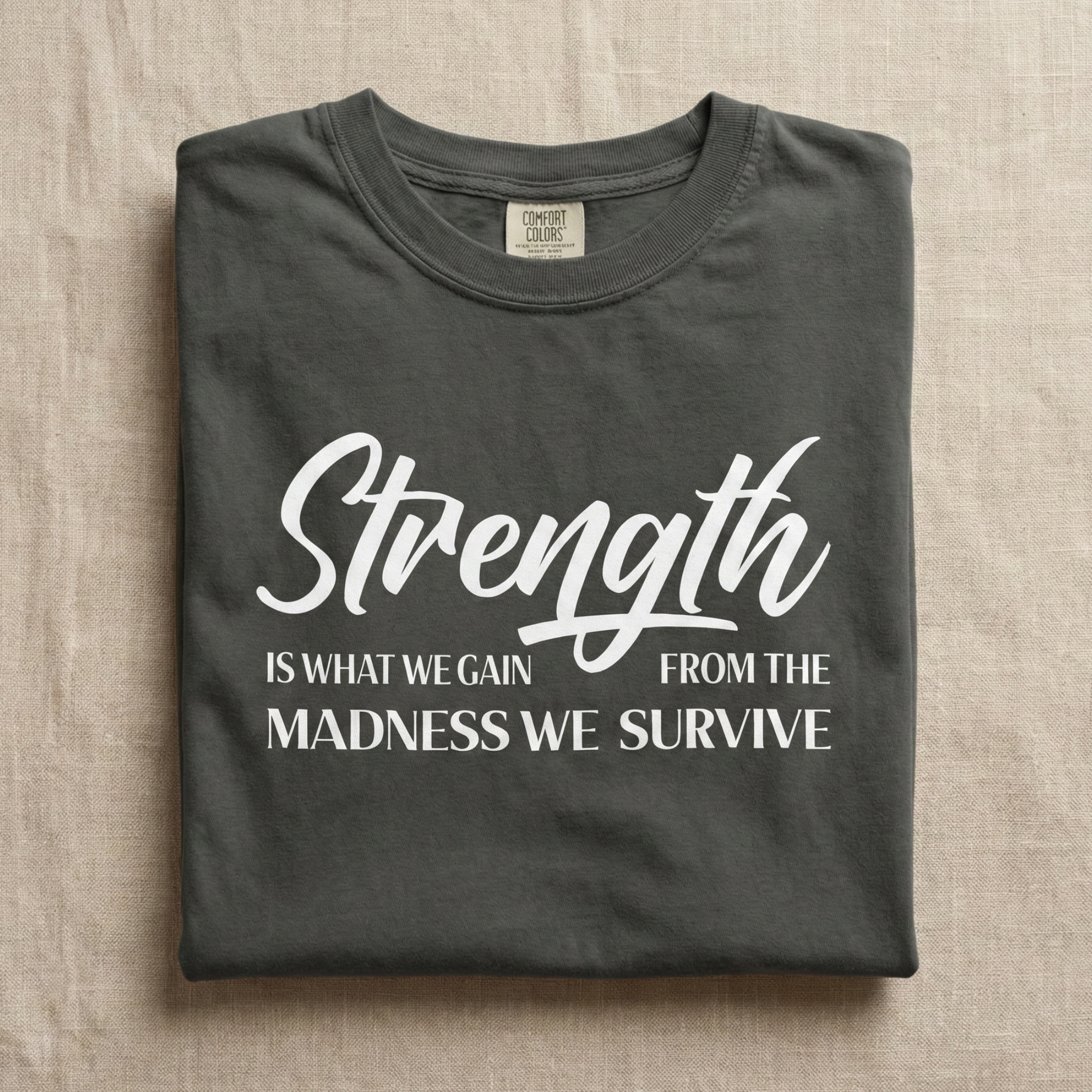 Strength Is What We Gain Encouragement Statement Tee