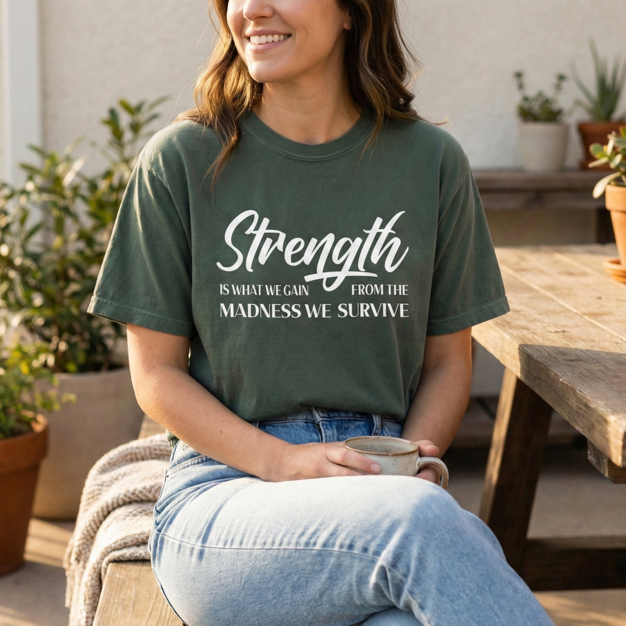 Strength Is What We Gain Encouragement Statement Tee Secondary image